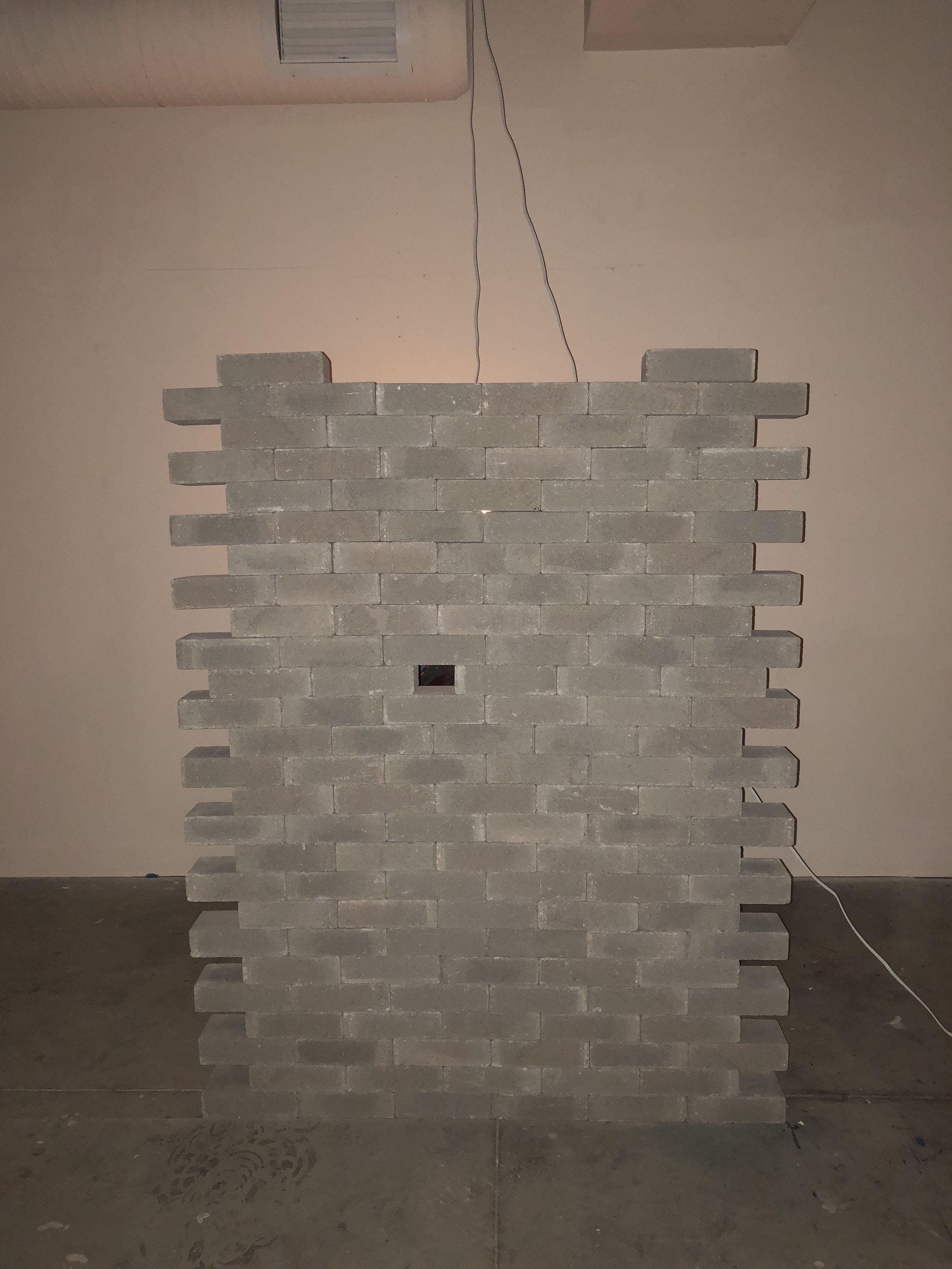”Misunderstand” / 2017 / 94.6inx45.8inx47.6in / concrete bricks, acrylic on canvas, lightbulb