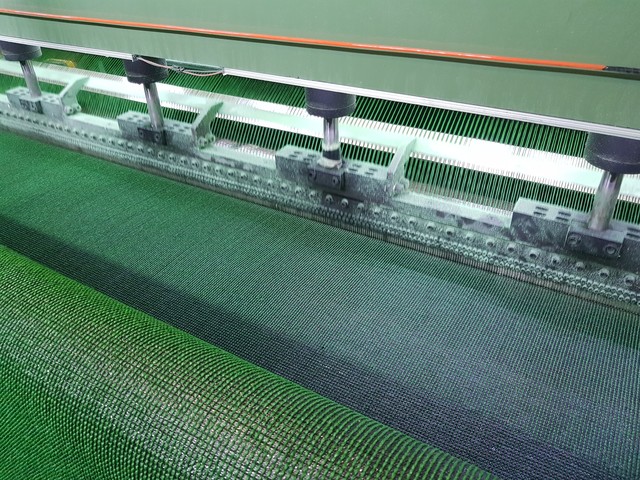 Planting yarn on non-woven fabric