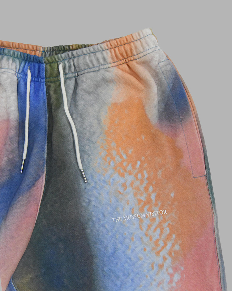【THE MUSEUM VISITOR】SPRAYED PRINTED JOGGER PANTS (MULTI) SPRAYED PRINTED JOGGER PANTS (MULTI) : THE MUSEUM VISITOR