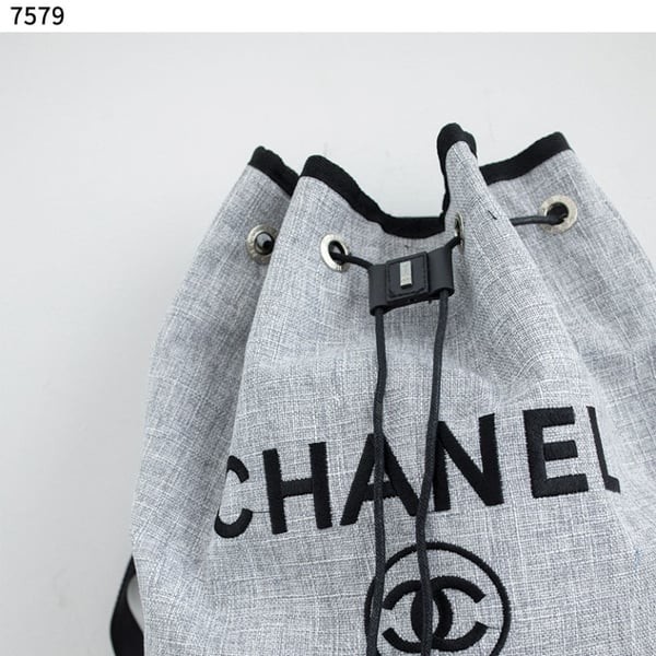CHANEL	샤넬 Deauville Leather Trimmed Raffia Backpack