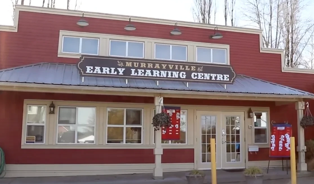 A red wooden school building of Murrayville Academy