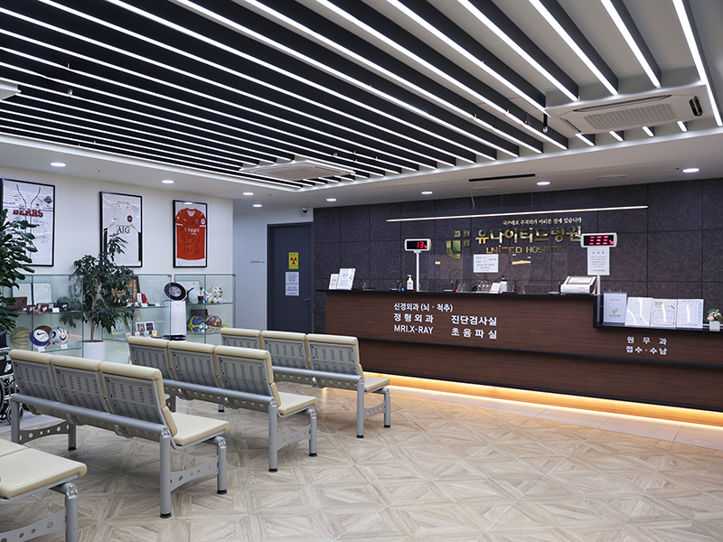 Branded reception desk and waiting seating at United Hospital Hanam