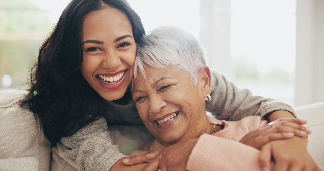 woman hugging another elderly woman