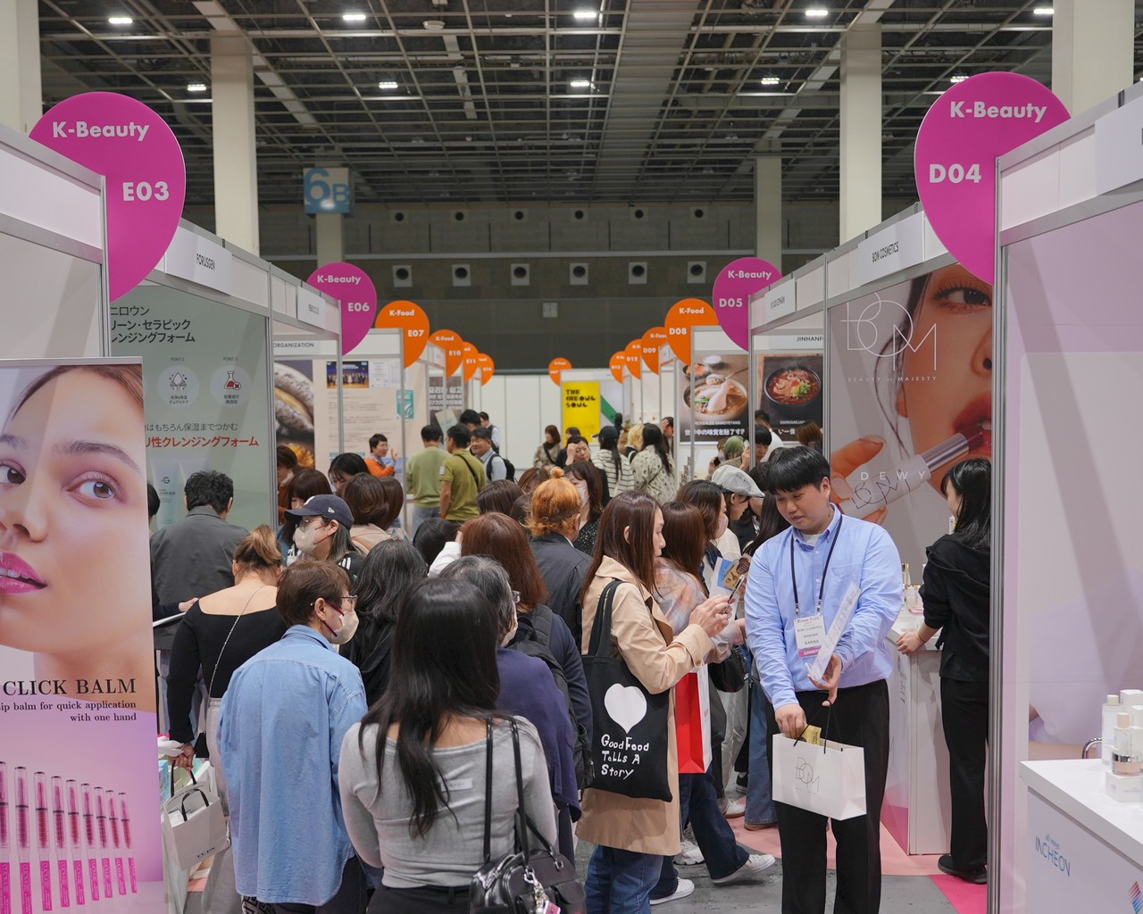 Aisle scene at Korea Expo—visitors and exhibitors engaged in demos and consultations