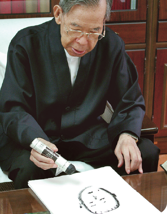 Drawing his self-portrait, May 30, 2007