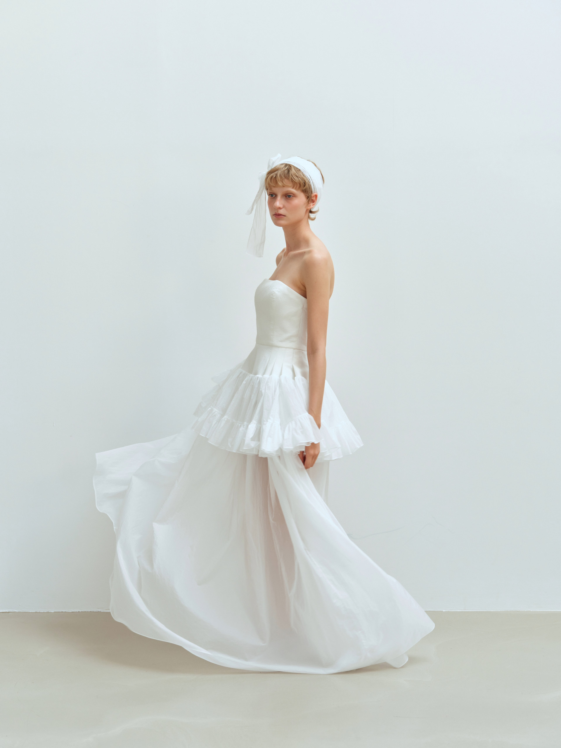 At yoil, we create wedding dresses <p> for one person at a time. <p> Every piece is designed, patterned, and sewn in our studio with patience and care. <p> We believe sincerity can be felt in the finished garment, and that the most beautiful dress is the one that naturally reflects the person wearing it