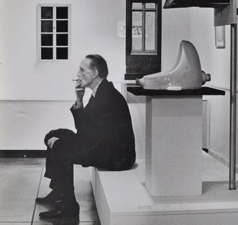 Julian Wasser Duchamp smoking in front of Fountain, Duchamp Retrospective, Pasadena Art Museum, 1963 Robert Berman Gallery