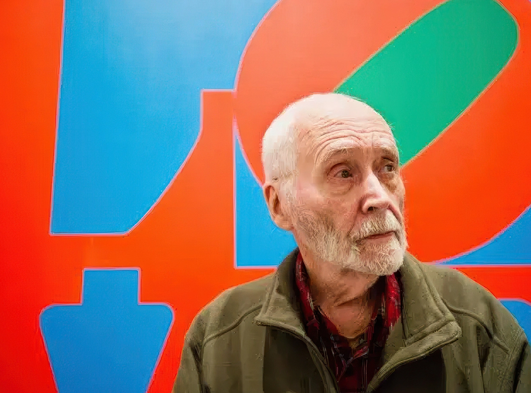 Robert Indiana first emerged as a pop artist in the early 1960s, but he was quickly defined by his 1966 signature work, LOVE, shown behind Indiana in this 2013 photo.