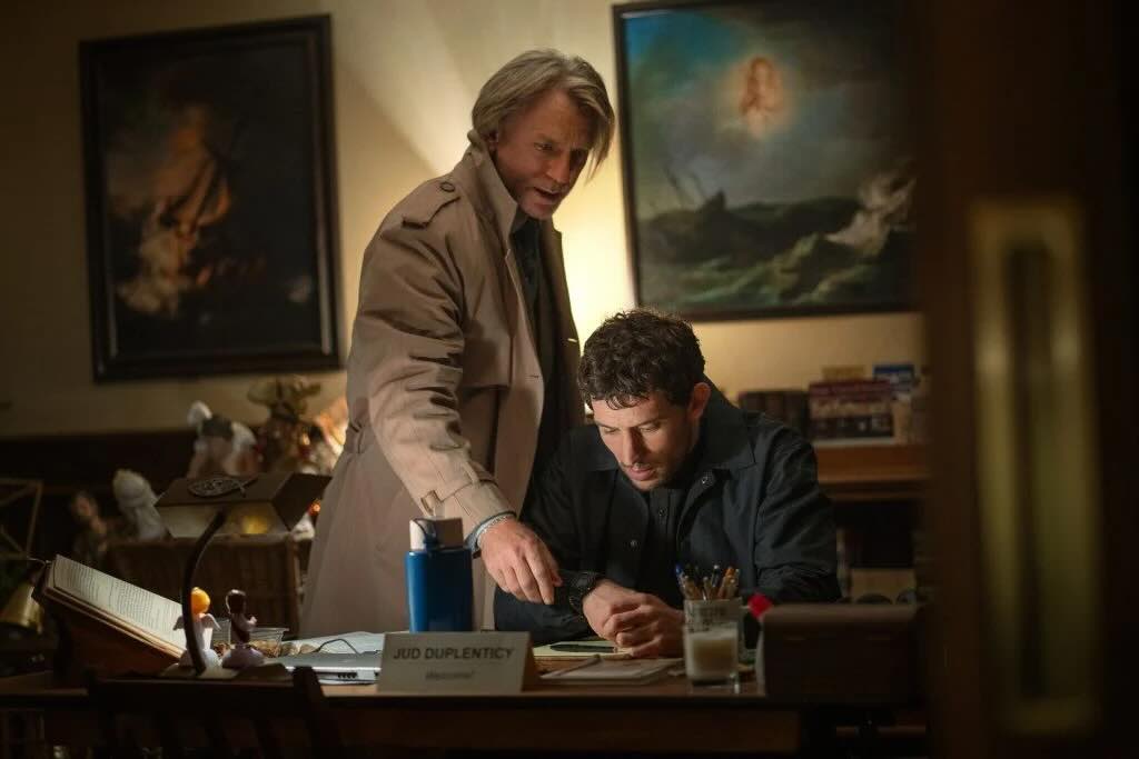 Detective Benoit Blanc (played by Daniel Craig) and Jud Duplenticy (played by Josh O'Connor) in Knives Out 3 . Courtesy of Netflix.