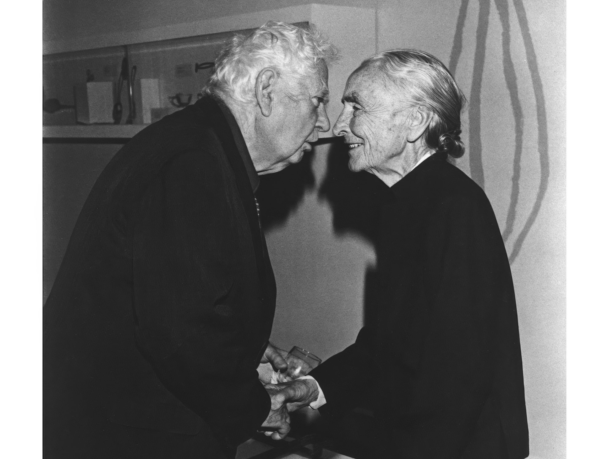 Alexander Calder greets Georgia O'Keeffe at a dinner held in his honor at the Whitney Museum in 1976. The photograph is among the archival materials featured in Hauser & Wirth's inaugural Palo Alto exhibition, "Calder | O'Keeffe." Photo Abner Symons/Courtesy the Calder Foundation