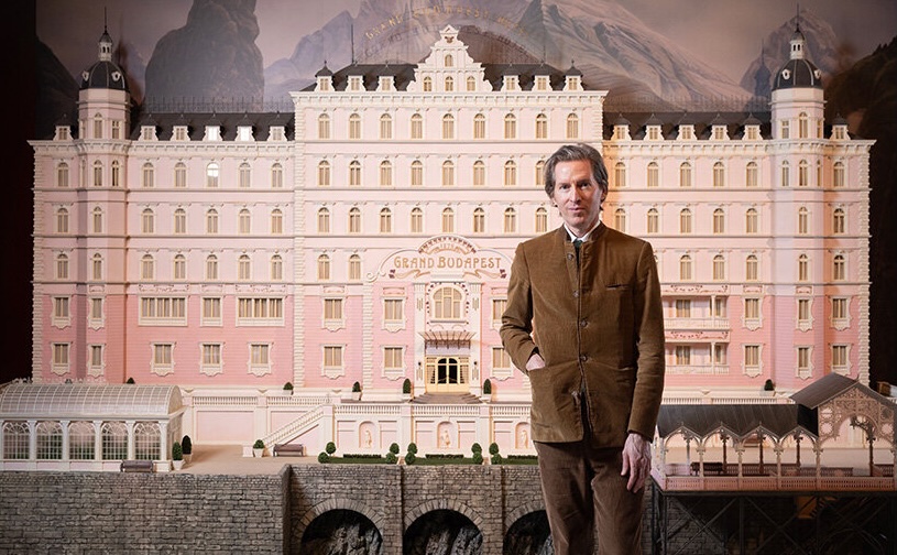 Wes Anderson in front of the Grand Budapest Hotel model | image by Matt Alexander, PA Media Assignments