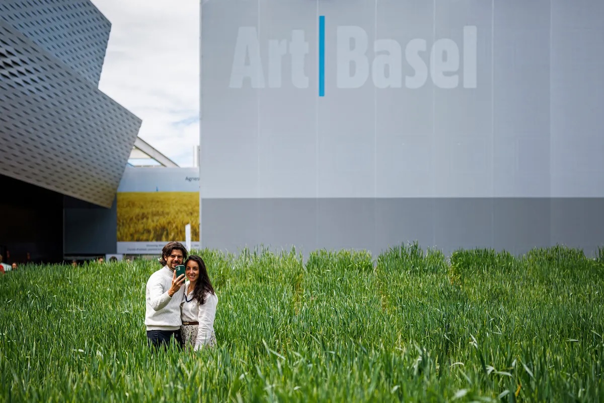 Visitors to Art Basel take a selfie. Photo Valentin FLAURAUD / AFP