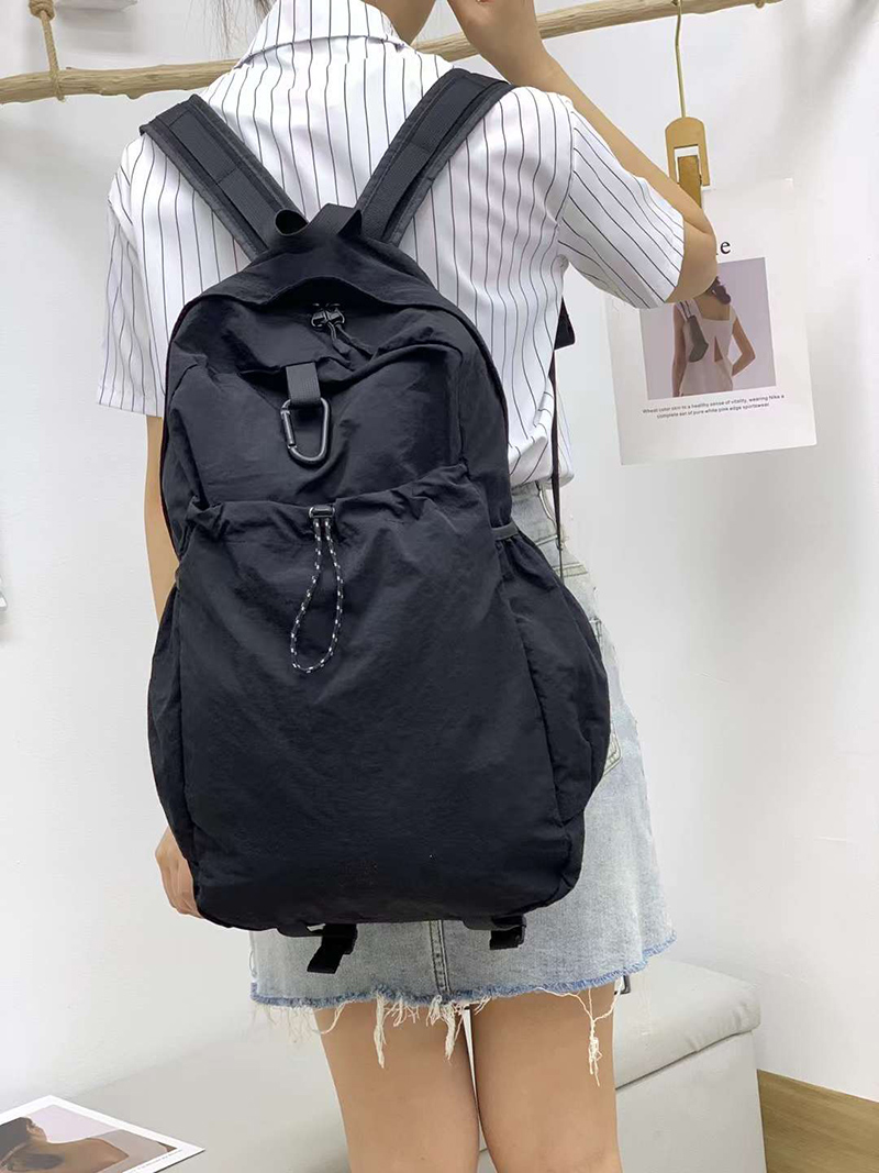Nylon backpack with waist drawstring pockets