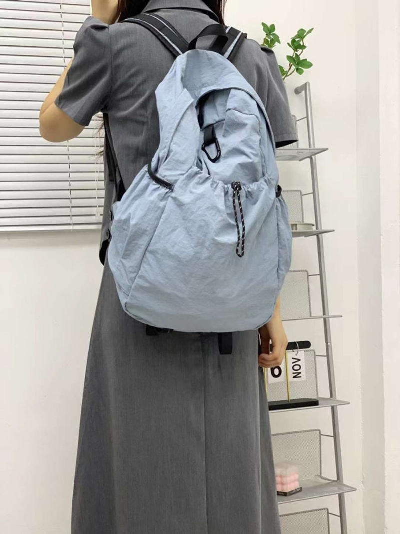 Nylon backpack with waist drawstring pockets