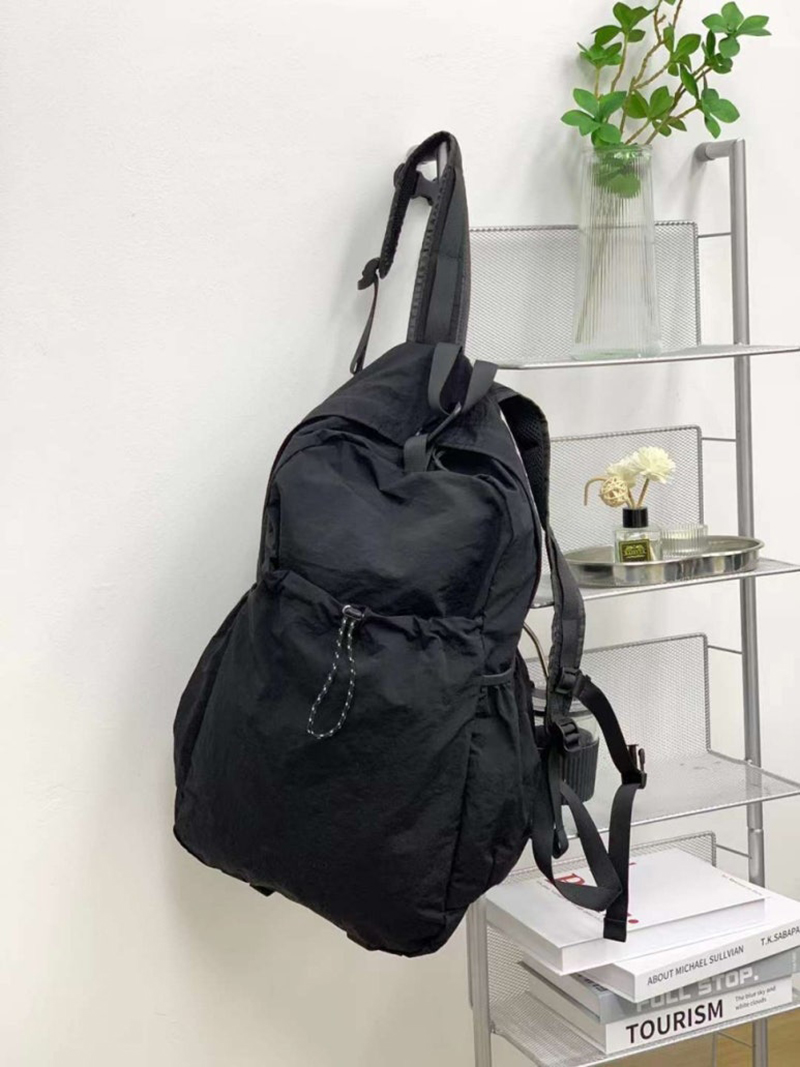 Nylon backpack with waist drawstring pockets