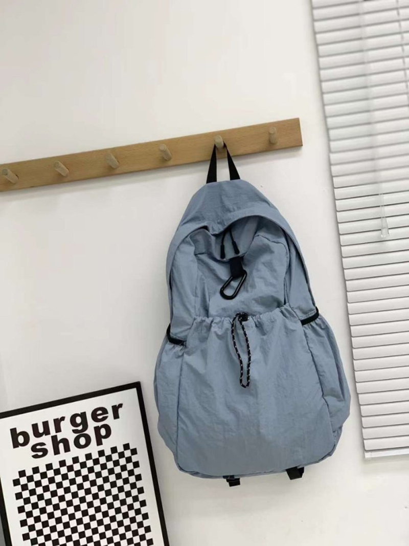 Nylon backpack with waist drawstring pockets