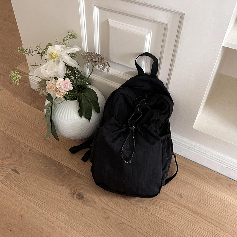 Nylon backpack with waist drawstring pockets