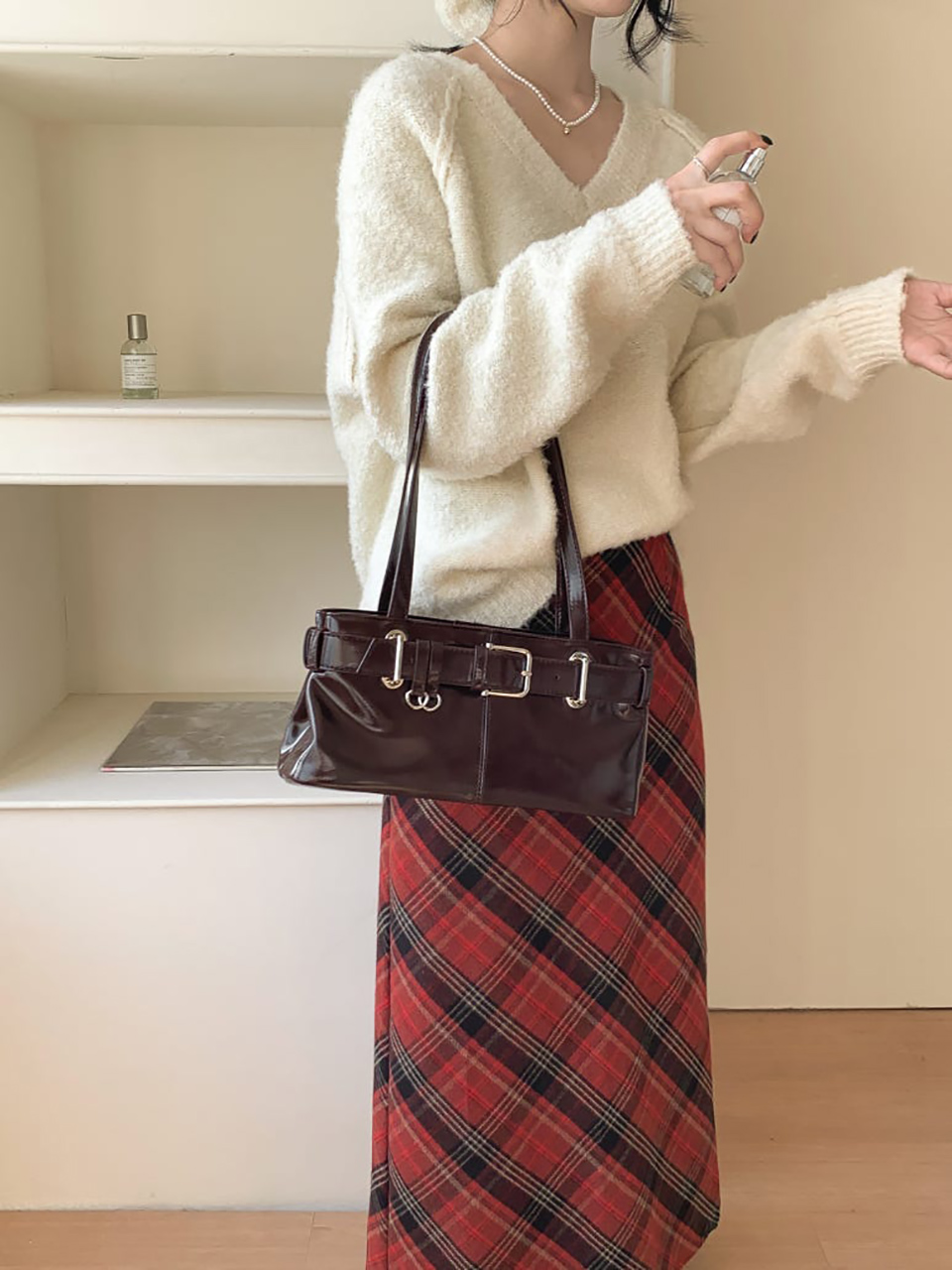 Belted glossy leather shoulder bag
