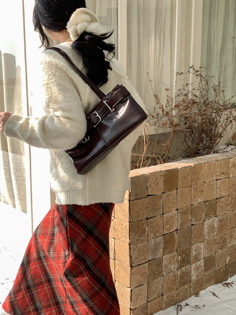 Belted glossy leather shoulder bag