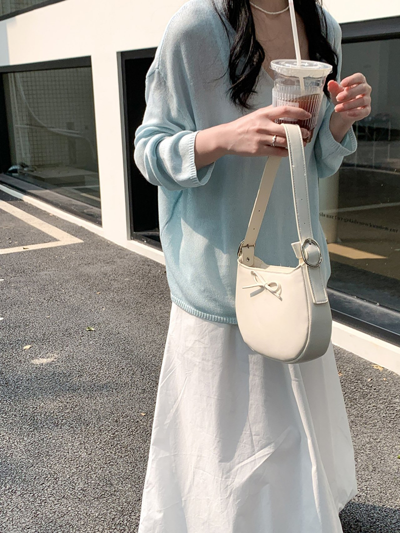 Ribbon buckle round leather shoulder bag