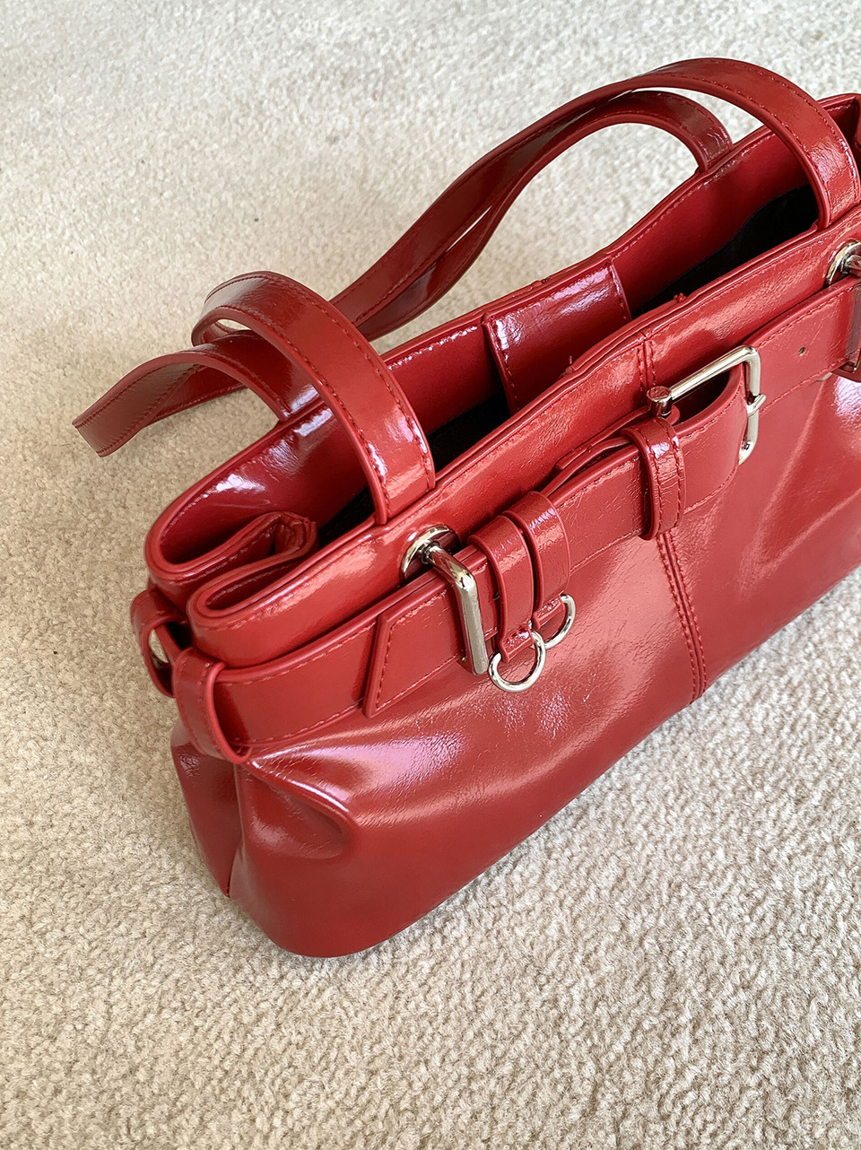 Belted glossy leather shoulder bag