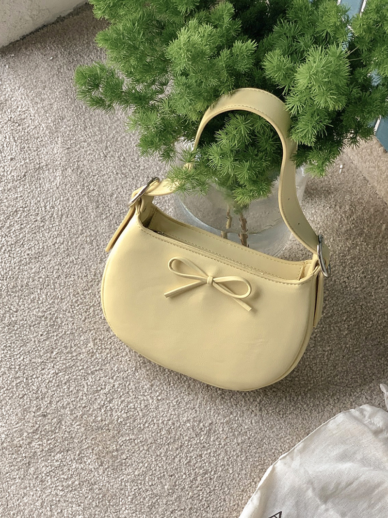 Ribbon buckle round leather shoulder bag