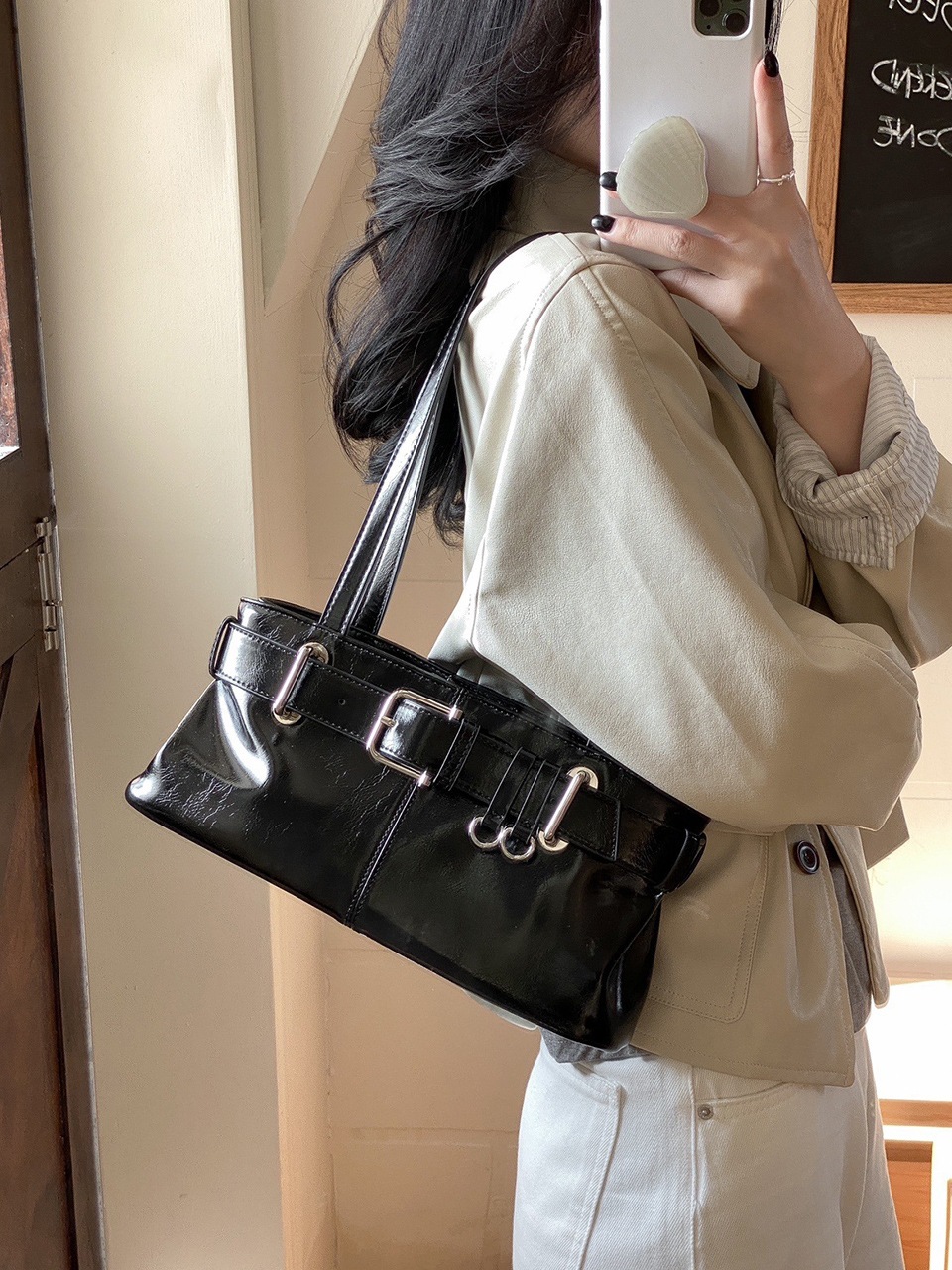 Belted glossy leather shoulder bag