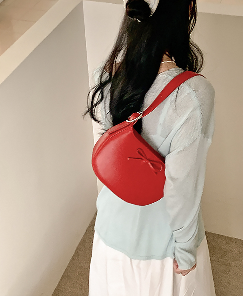 Ribbon buckle round leather shoulder bag