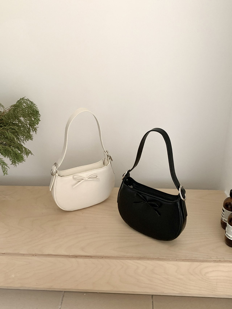 Ribbon buckle round leather shoulder bag