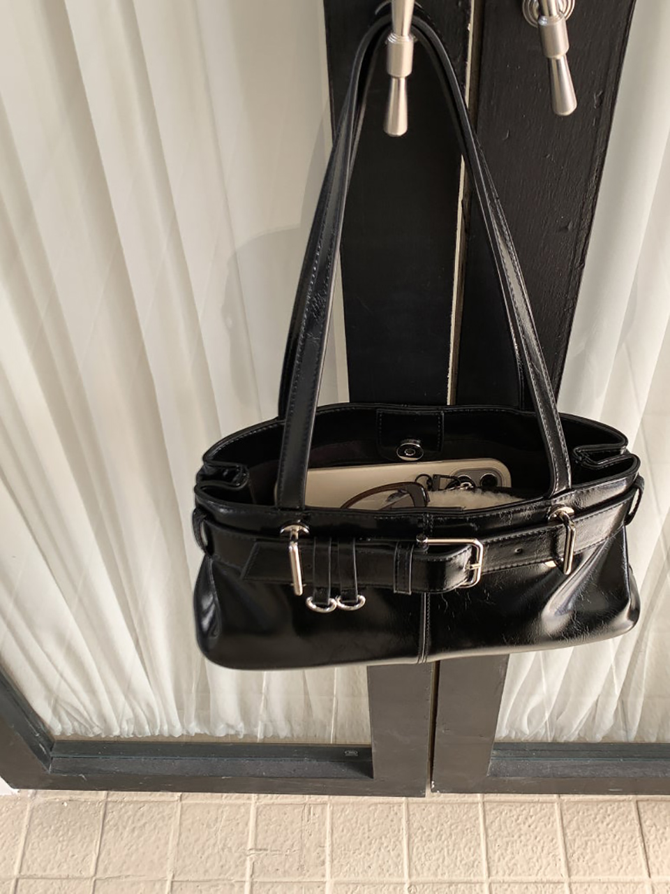 Belted glossy leather shoulder bag