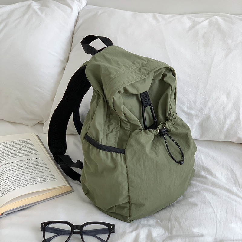 Nylon backpack with waist drawstring pockets