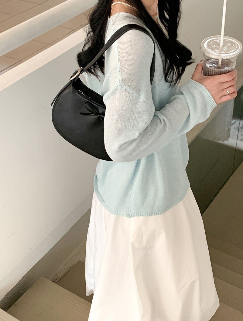 Ribbon buckle round leather shoulder bag