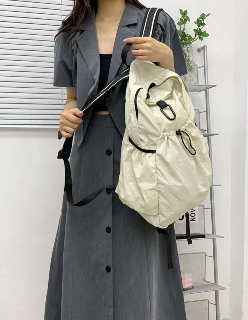 Nylon backpack with waist drawstring pockets