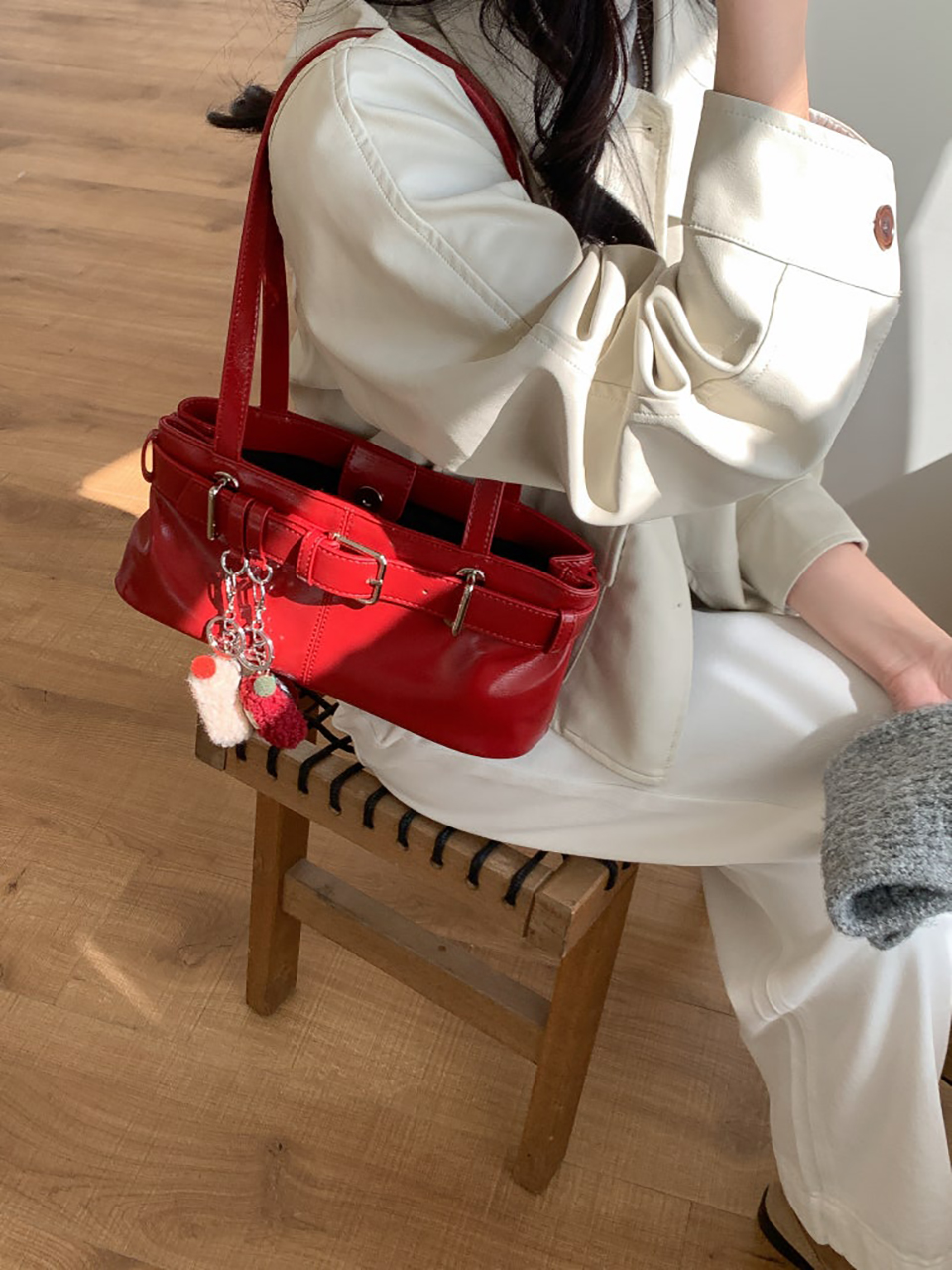 Belted glossy leather shoulder bag