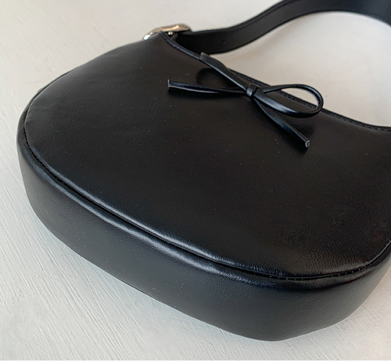 Ribbon buckle round leather shoulder bag