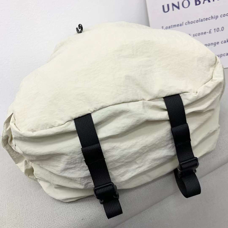 Nylon backpack with waist drawstring pockets
