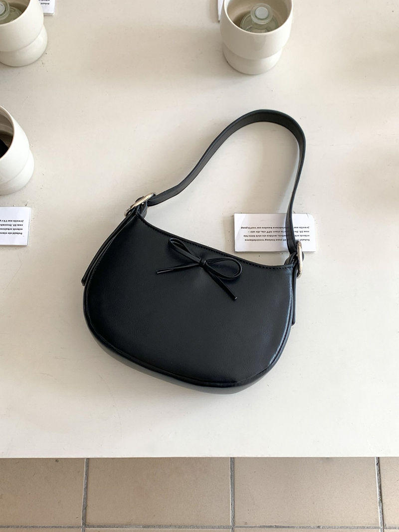 Ribbon buckle round leather shoulder bag