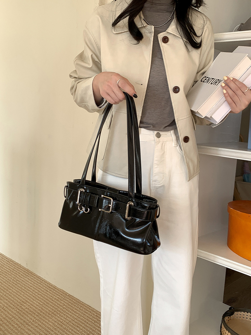 Belted glossy leather shoulder bag