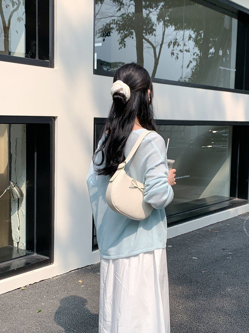 Ribbon buckle round leather shoulder bag