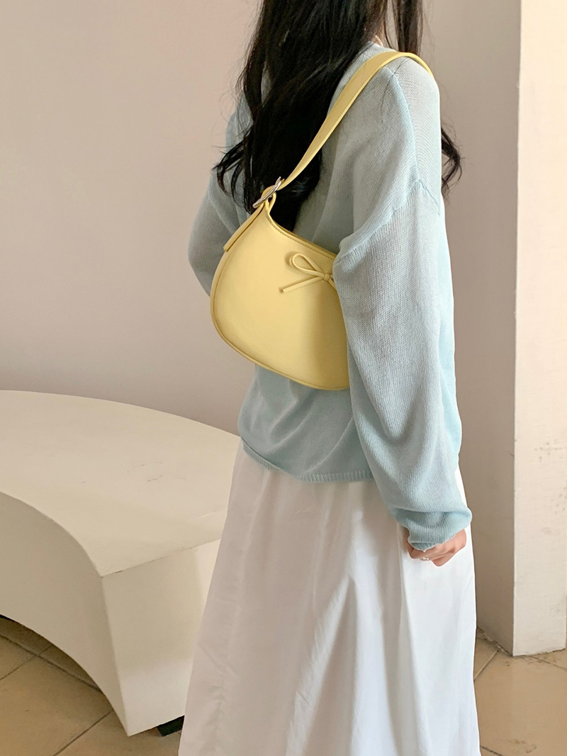 Ribbon buckle round leather shoulder bag