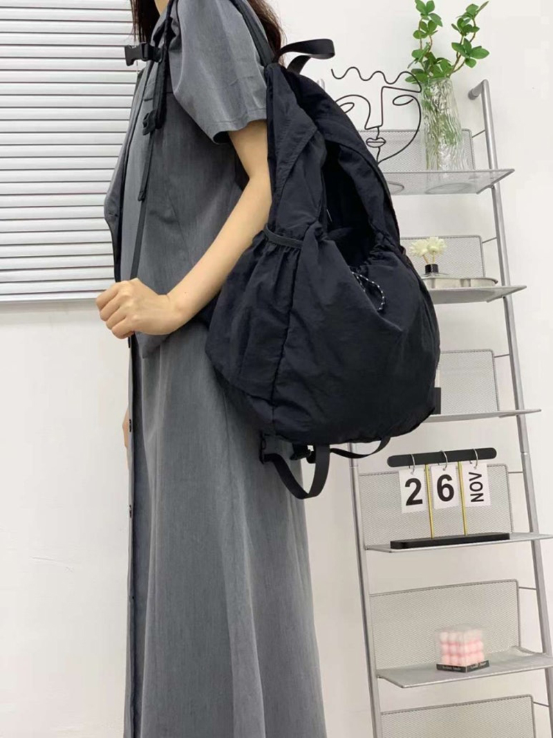Nylon backpack with waist drawstring pockets