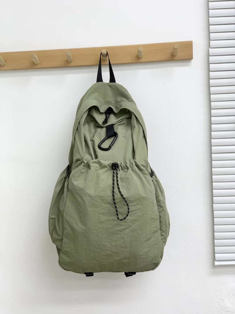 Nylon backpack with waist drawstring pockets