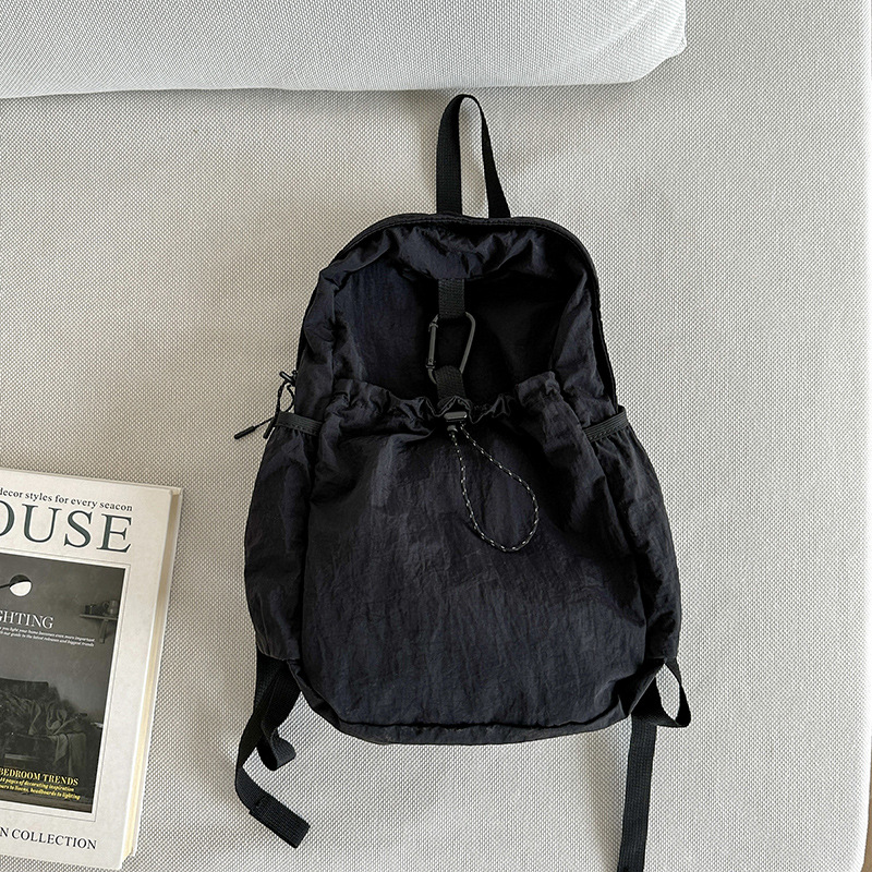 Nylon backpack with waist drawstring pockets
