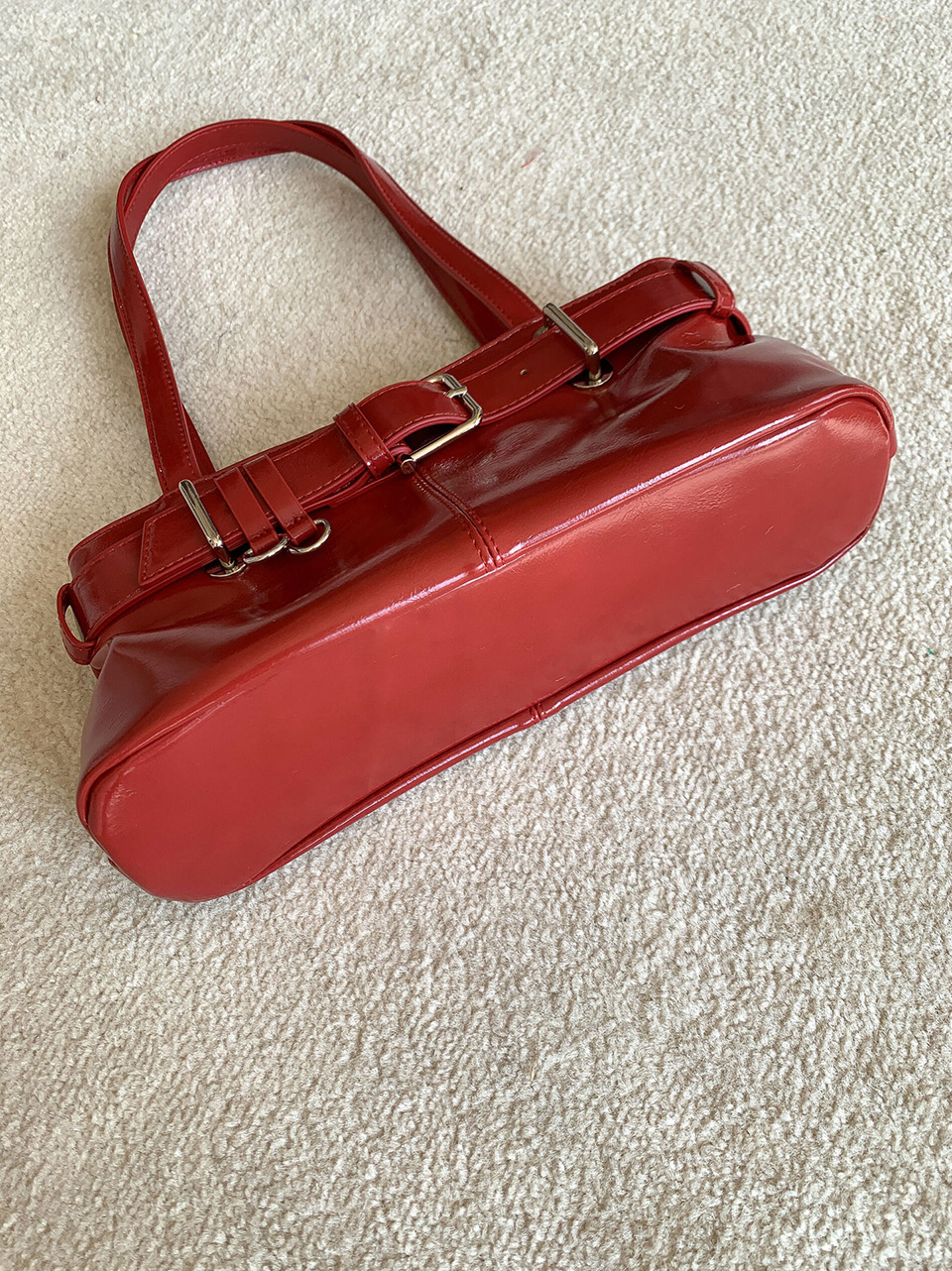 Belted glossy leather shoulder bag