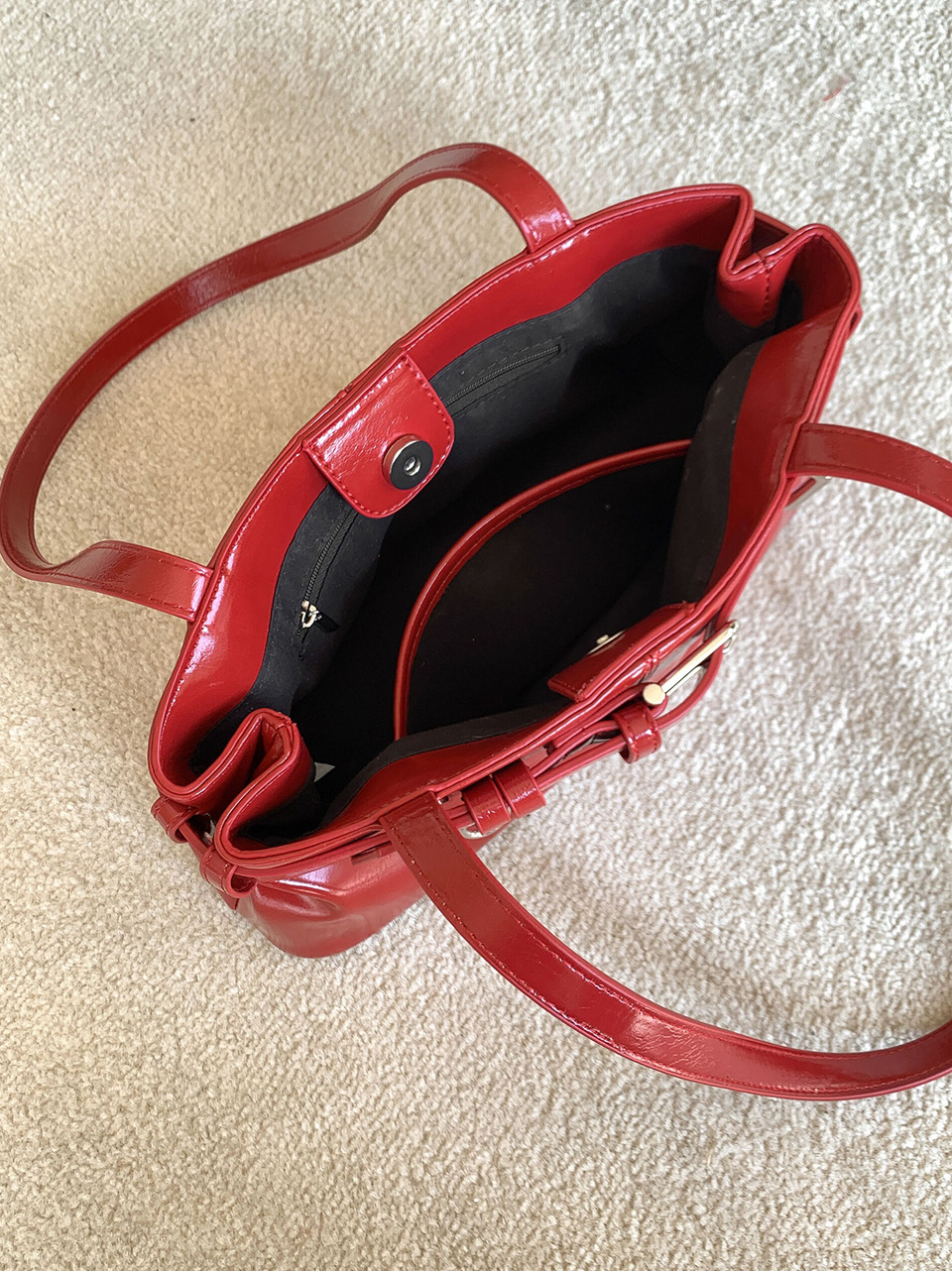 Belted glossy leather shoulder bag