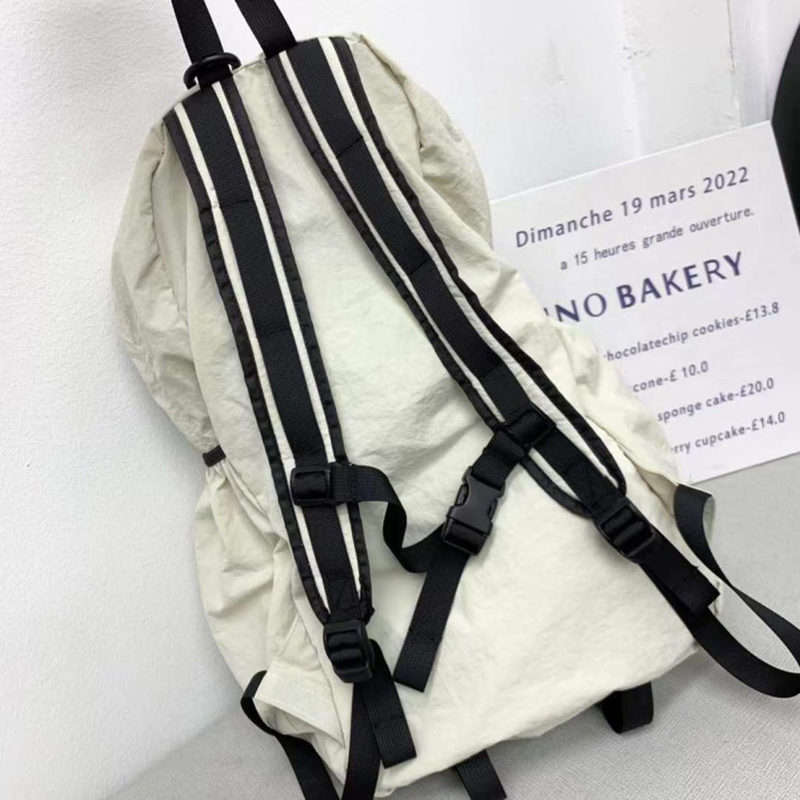 Nylon backpack with waist drawstring pockets