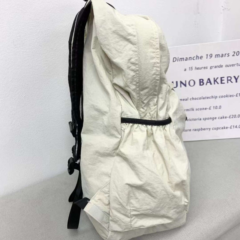 Nylon backpack with waist drawstring pockets