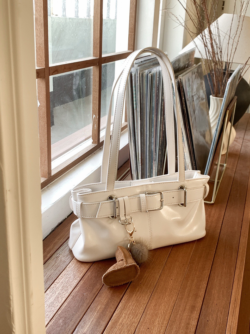 Belted glossy leather shoulder bag