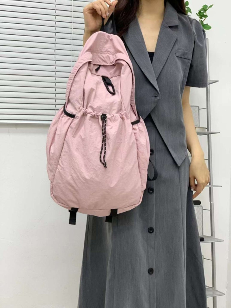 Nylon backpack with waist drawstring pockets