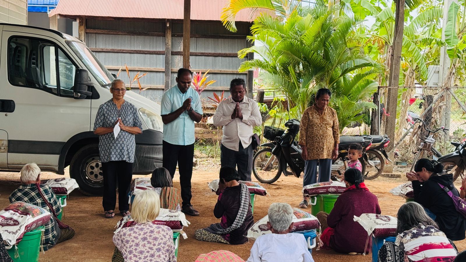 Fr. Michael from Don Bosco distribut Emergency kit to Thnal Batt villagers.jpg
